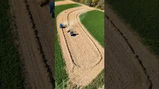 Raking and round baling corn stalks! #agriculture #farming #farmer #newholland #bale #farm #tractor