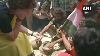Priyanka Gandhi holds snakes in her hands while campaigning in Raebareli