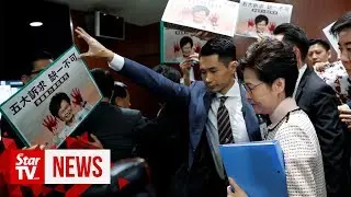 Hong Kong policy address halted after heckling