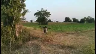 Female resistance fighter fires homemade recoilless rifle - Sagaing Region, Myanmar - ca. Dec 2020