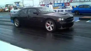 Tris Thompson in his Charger SRT8