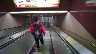 Taiwan, Taipei, NTU Hospital MRT Station, escalator ride down to ticket concourse level