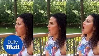 Woman shows off her impressive gum boomerang trick - Daily Mail