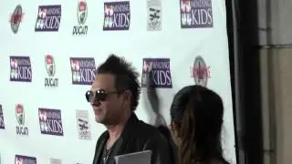 Steve Ferlazzo on red carpet at Mending Kids Music On A Mission at Lucky Strike in Hollywood