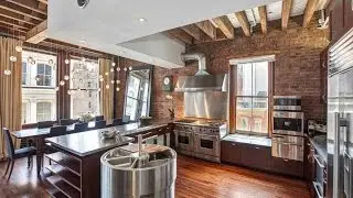 Exposed brick wall dining room