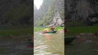Rowing boat with feet in Tam Coc, Vietnam