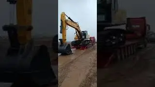 The large excavator for lowbed semi trailer transportation, arrives safely and smoothly