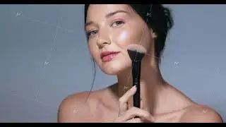 Confident Young Woman Highlighting Cheekbones With Makeup Brush