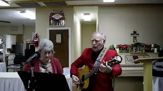 Рождественское собрание в баптистской церкви «Табернакль» в Мебане, 23.12.2025 — Барри и Долли поют.