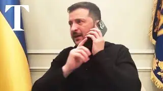 Zelensky puts phone down on Macron during briefing