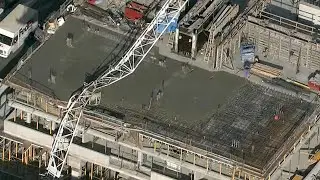 Crane collapses onto building under construction in Toronto