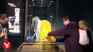 Activists throw custard at Crown Jewels in Tower of London protest