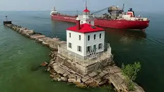 Frontenac turns in Lake Erie and passing Fairport Harbor West Breakwater Lighthouse Bow Thruster