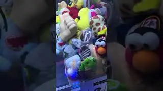 There is a Deadpool keychain stuck inside the claw machine ￼