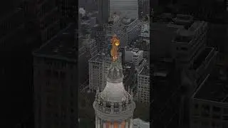 Serene Skies: Manhattan Municipal Building Statue