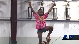 Local squad becomes first African American cheer team to win High School NCAA National Championship