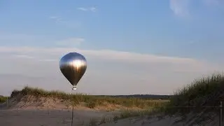 Watch Doug Aitkens' 30-metre-tall mirrored hot air balloon take flight