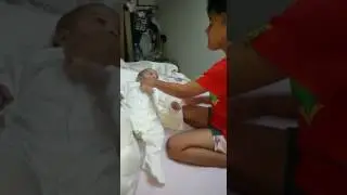 Big brother playing about with sisters