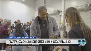 Wilks, Brown hand out Harris Teeters holiday meal bags
