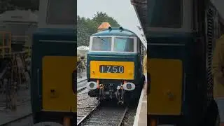 HYMEK DOUBLE-HEADER: Diesel locomotive D7017 waits at Minehead