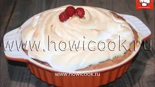 Baked Alaska cake with ice cream and raspberries