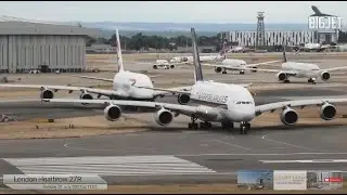 Close-up departures at London Heathrow Airport, rwy 27R Ft Double stack A380 departure at 01:24:30