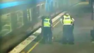 Australian woman escapes being hit by train in last-second rescue