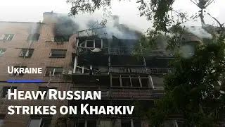 Firefighters tackle smouldering building after Kharkiv strike | AFP