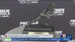 Heisman Memorial Trophy comes to Morgantown car dealership