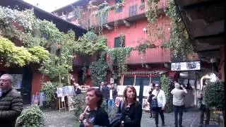 about 10 seconds in a courtyard, Navigli, Milan