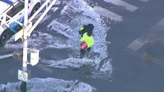 Hero Crossing Guard carried a kid on his back across a water soaked Chicago street