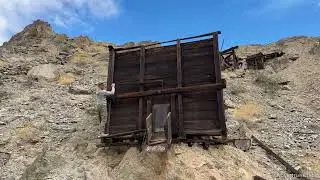 Operating the Gate on an Old Gold Mine Ore Bin in Death Valley