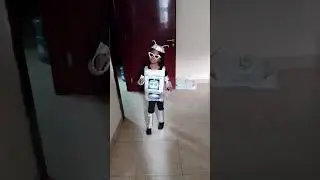 Robot costume made with recycled materials. theme: my dream planet with AI buddies.