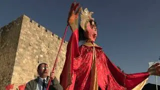 Shimshon Leshinsky Holds Marionette Puppet at Jerusalem 'Tastes of the World' Food Festival