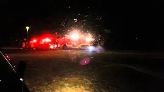 Night scene flight landing in football field.