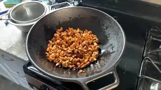 Roasting cashews in a cast iron wok ￼