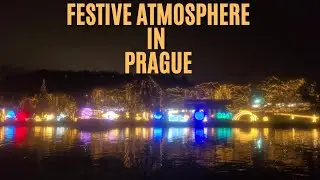 The city glows with Christmas lights as you cruise along the Vltava River | Crystal Dinner Cruise.
