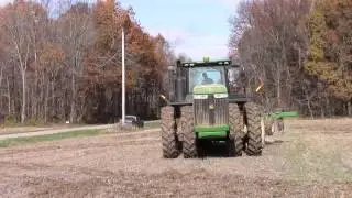 John Deere 9410R Working Ground Through A Muddy Spot