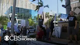 Florida schools reopen amid COVID surge and debate over mask use