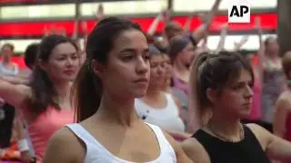 Thousands Do Yoga In Times Square