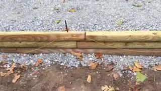 INSTALLING A WOODEN RETAINING WALL