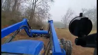 Feeding the cows with the New Holland Workmaster 75