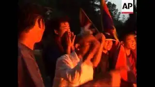 Tibetan exiles burn Chinese goods and flags