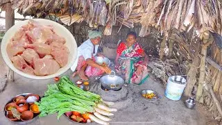 Santali tribe old couple cooking mulo shak curry and chicken curry in tribal style for lunch