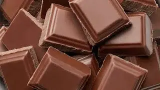 Chocolate Pieces Rotating. Chocolate Background.