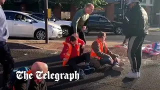 Insulate Britain activists pulled off the road by drivers, police and a paramedic