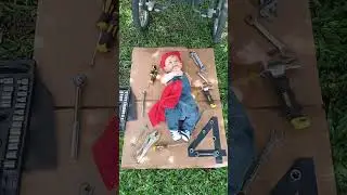 Baby dressed as a mechanic pretends to fix stroller in El Cerrito, Colombia