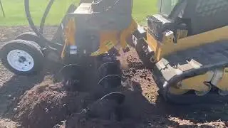 Trench forward!  Bainter Boomer skid steer trencher