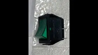 The boat-shaped Green switch on the commercial stainless steel refrigerator C55R-green