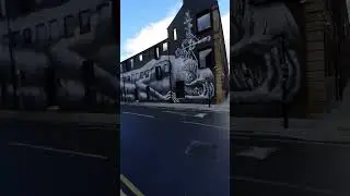 Sheffield city centre artist Phlegm fantastic wall art on former Eye Witness Works Headford St.